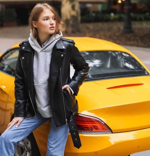 young-beautiful-woman-in-leather-jacket-leaning-on-VDAU5XM.jpg